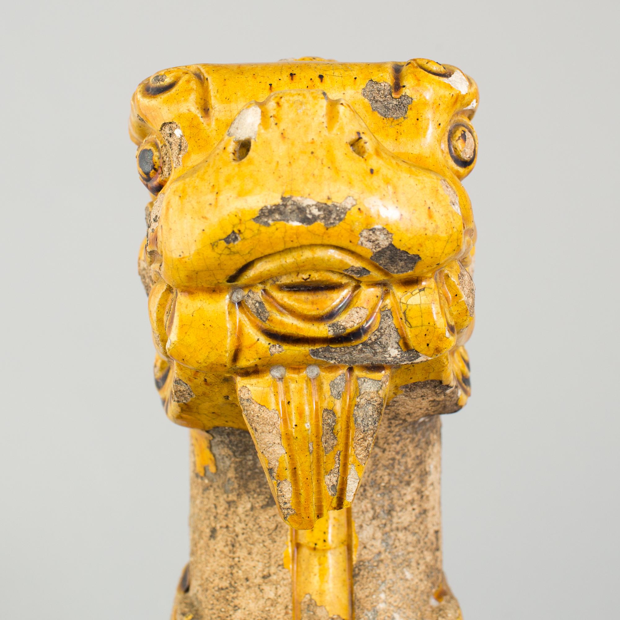 A yellow glazed fragment of a rooftile, Ming dynasty (1368-1644).