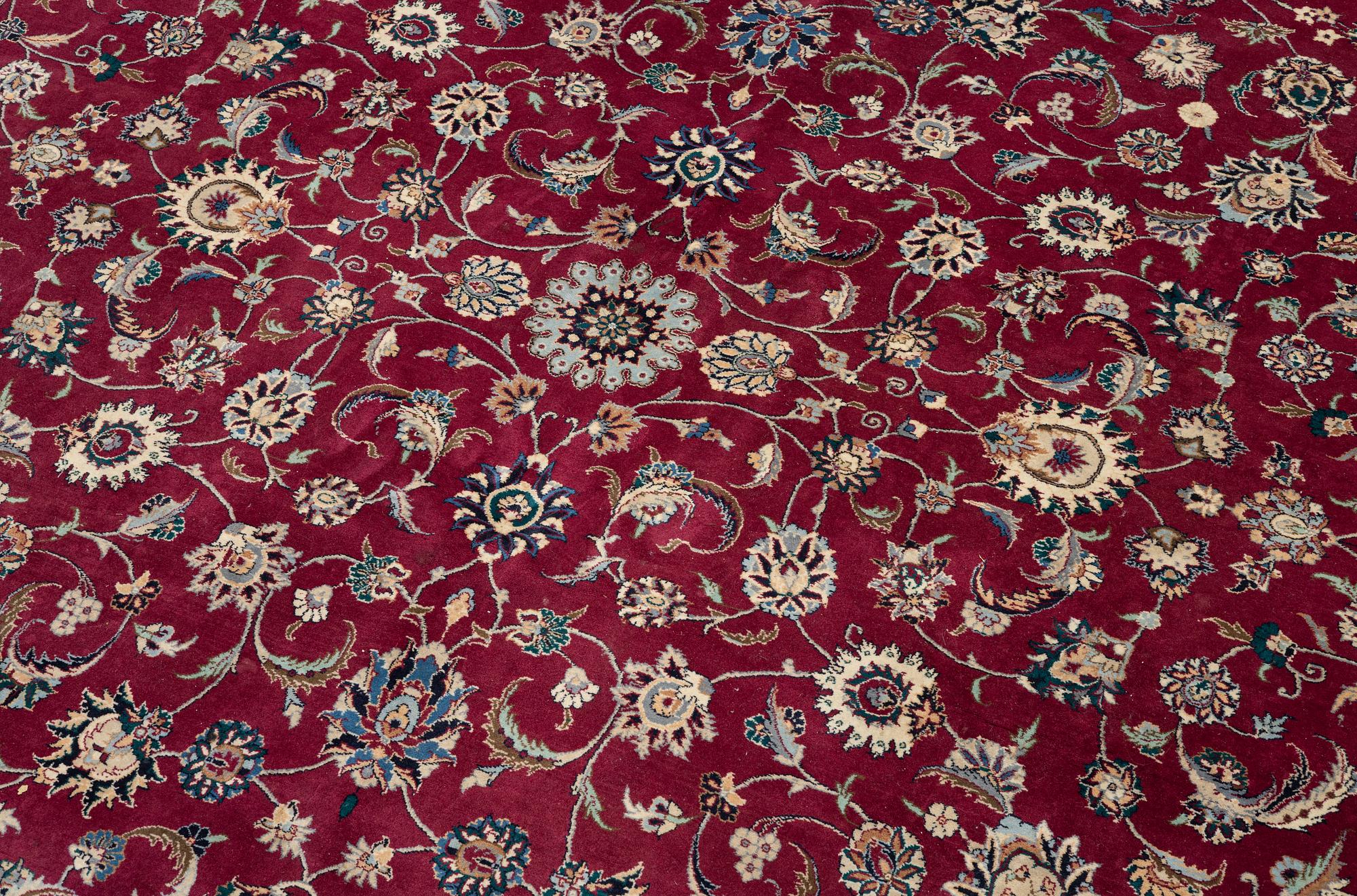 An oriental carpet, a. 378 x 278 cm.