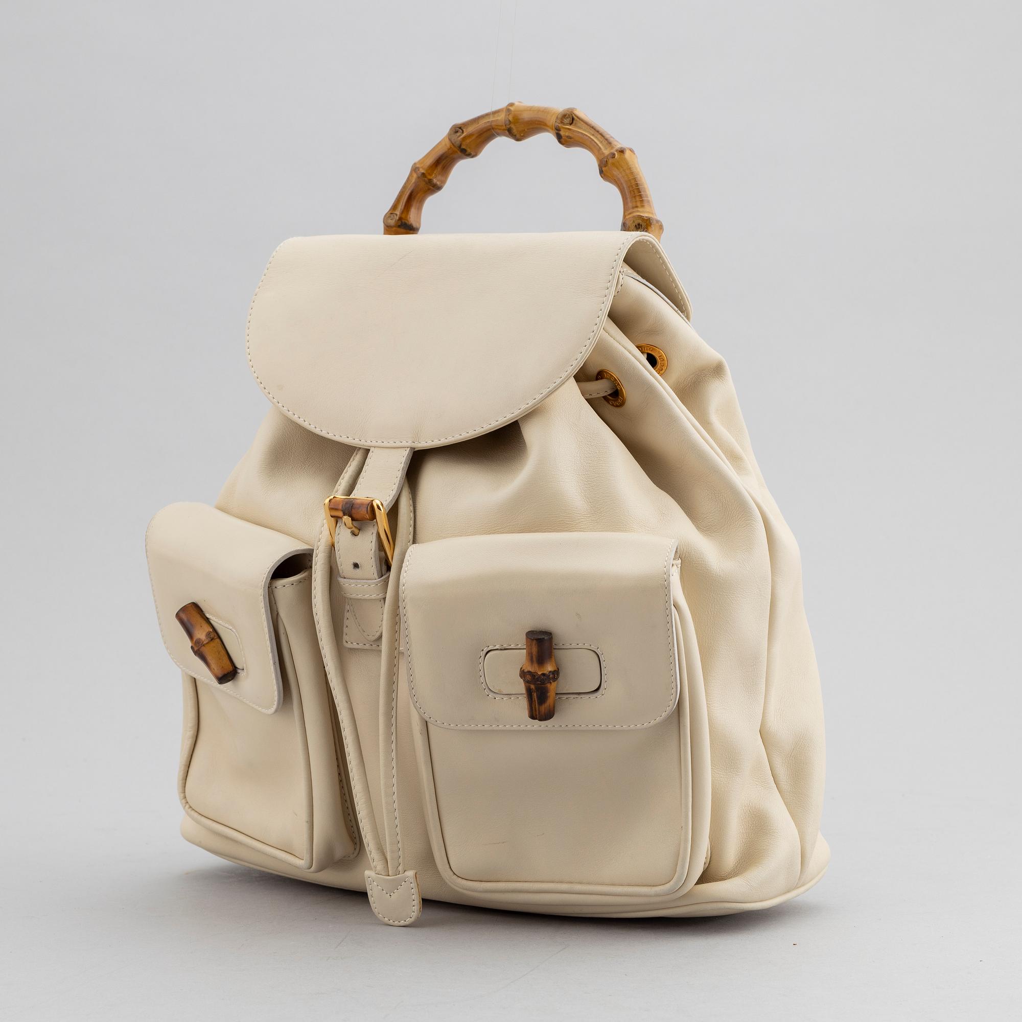 Gucci, a white leather backpack with bamboo handle. - Bukowskis