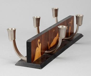 LJUSSTAKE, Mjölby Intarsia, 1900-talets första hälft.