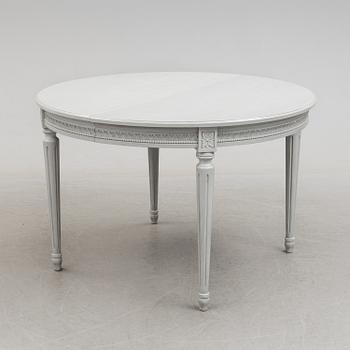 A Gustavian style dining table and ten chairs, 20th century.