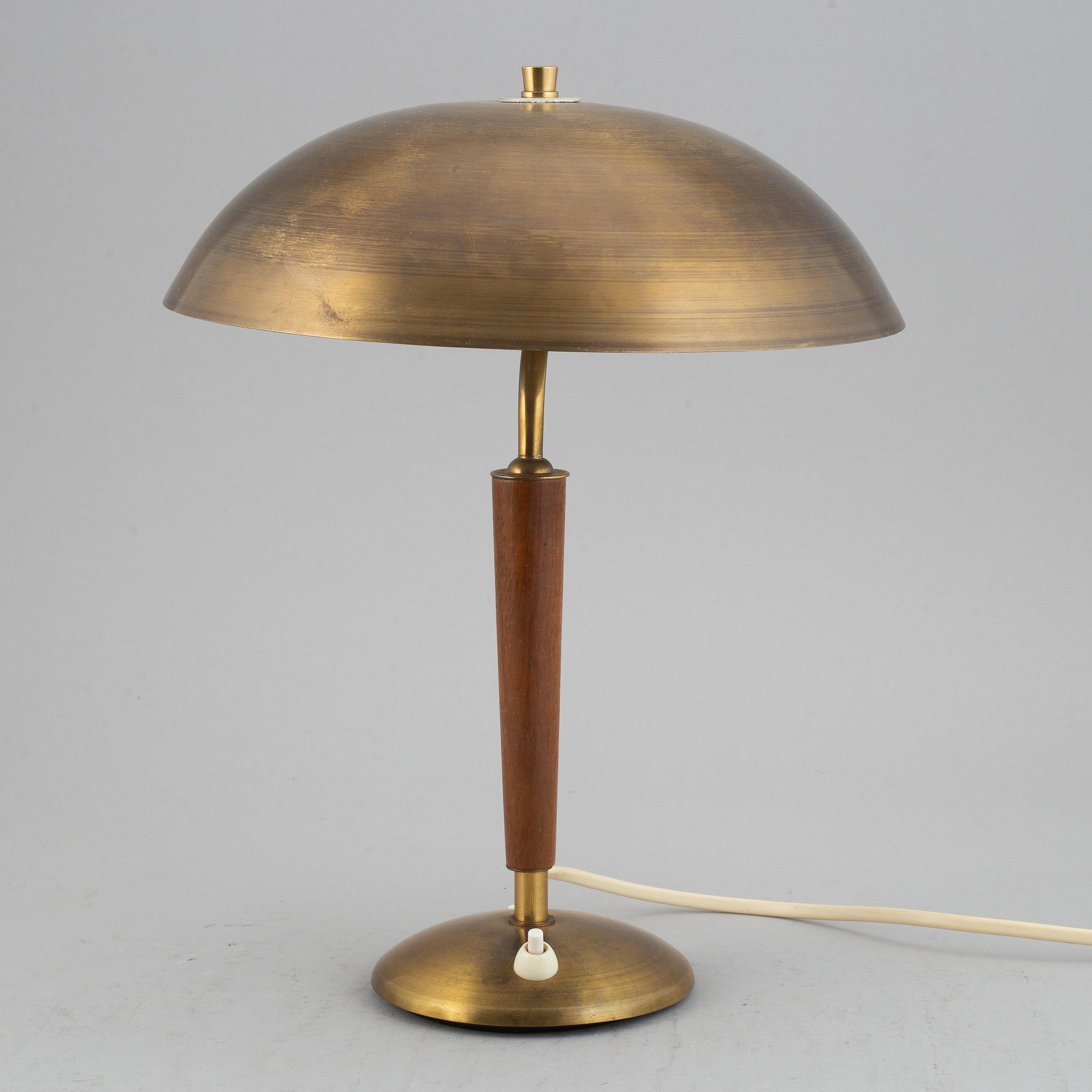 A brass and teak table lamp, 1960's.