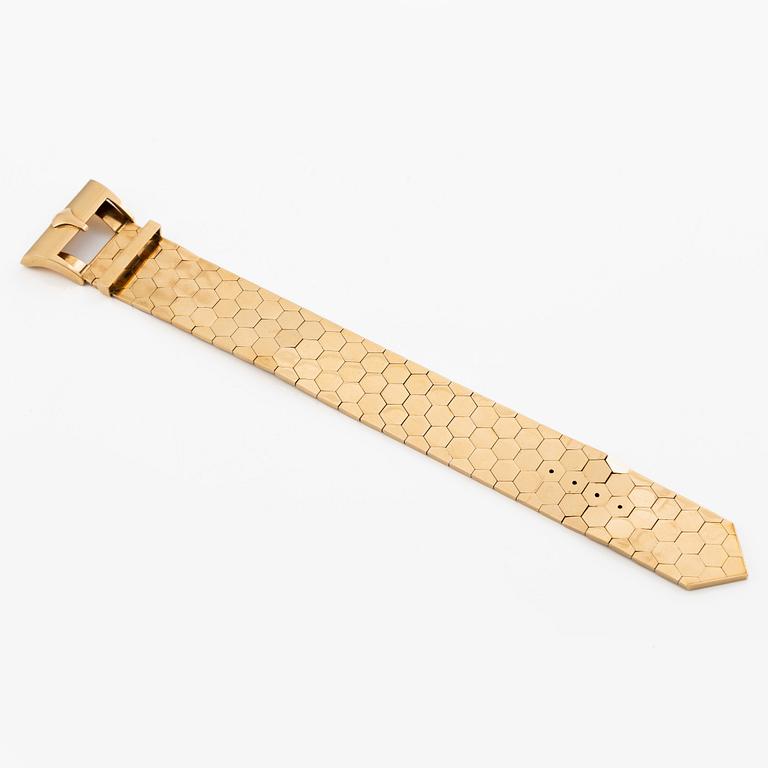 A bracelet 18K gold in the form of a belt.