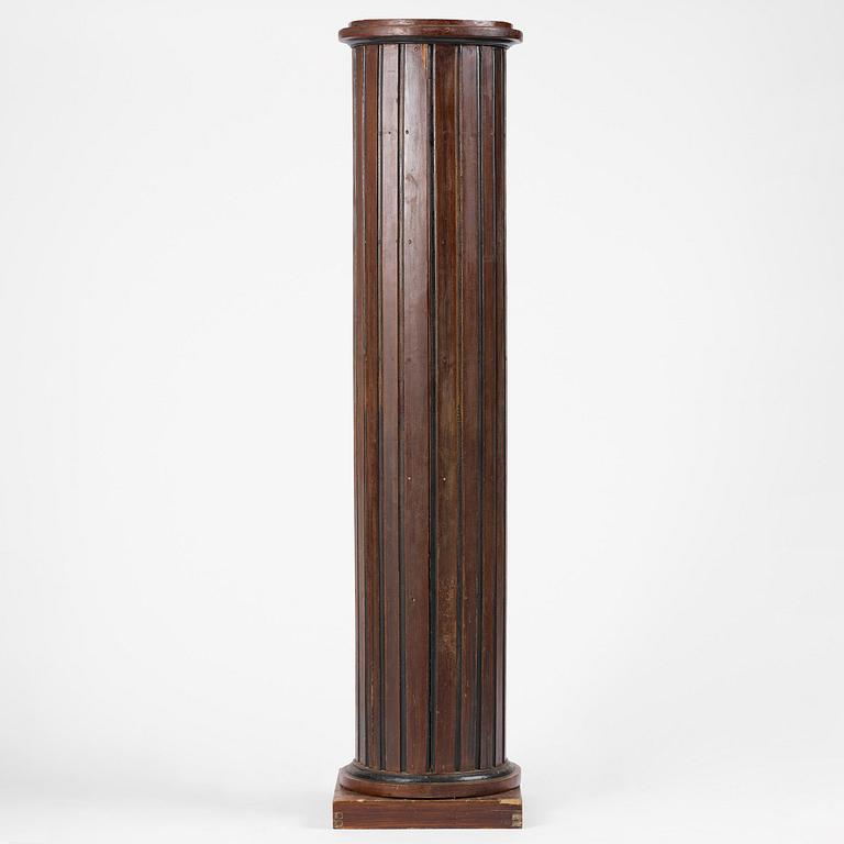 A Swedish Empire column-shaped cabinet, first part 19th century.