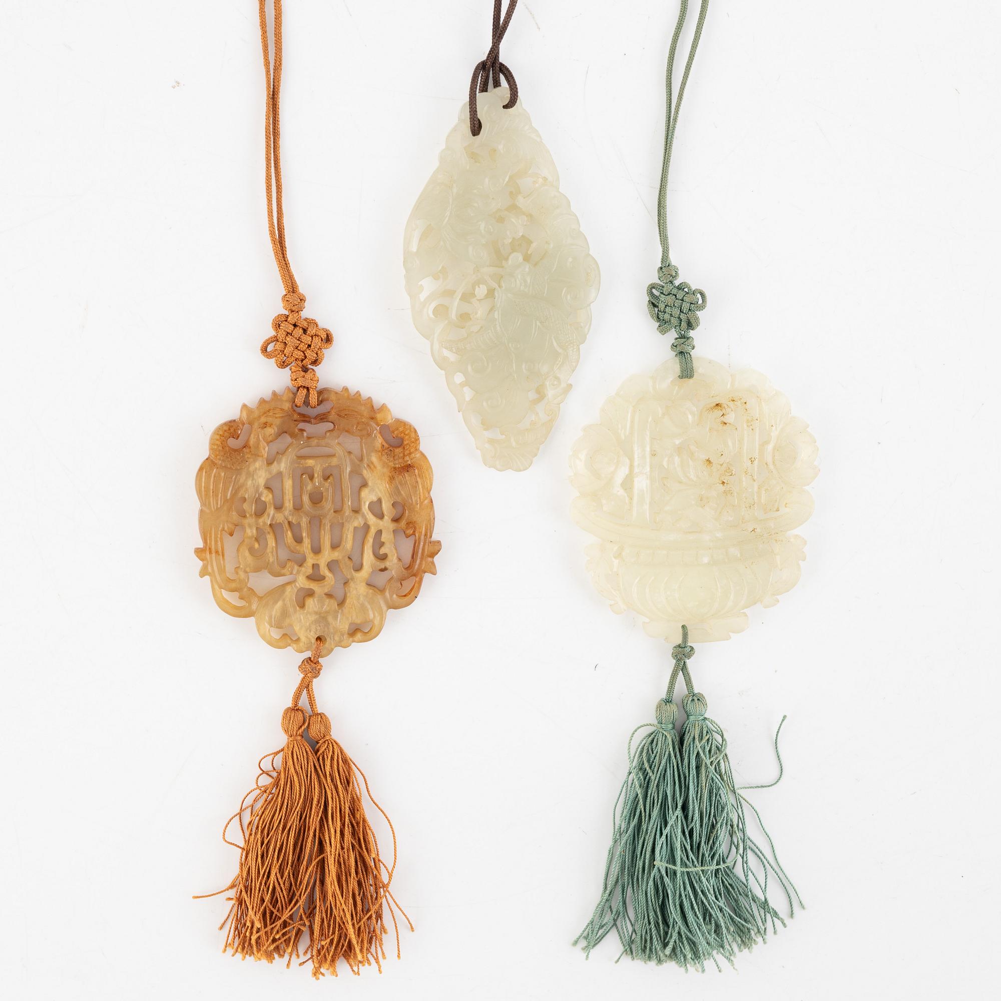 A group of three Chinese stone amulets, probably 20th century.