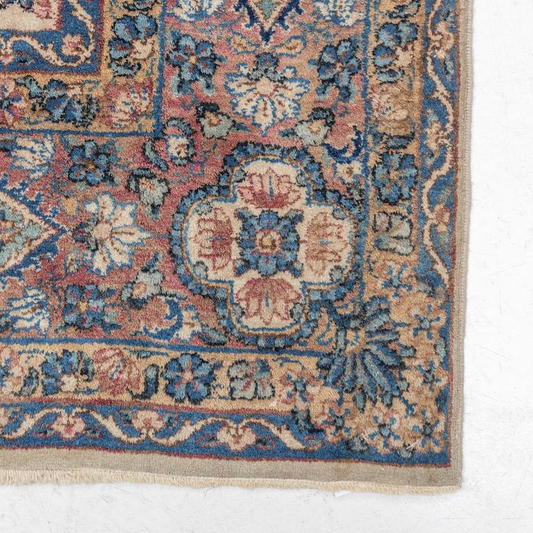 A semi-antique Kerman carpet, c. 273 x 172 cm.