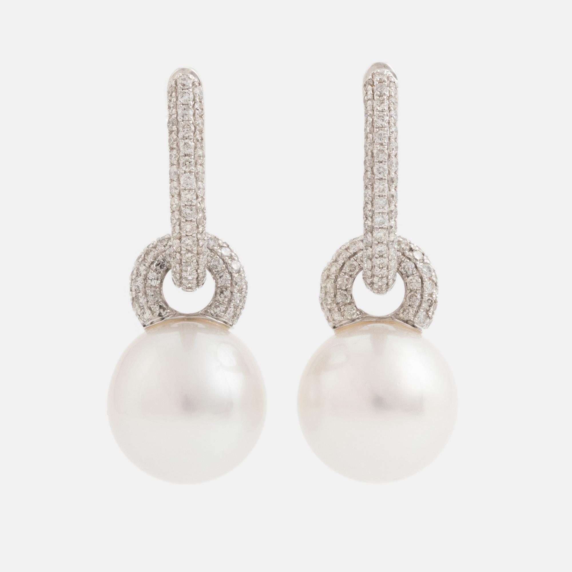 Pearl and brilliant cut diamond earrings.