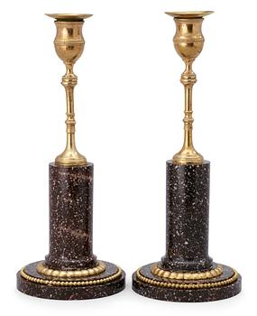 A pair of late Gustavian circa 1800 porphyry and gilt bronze candlesticks.
