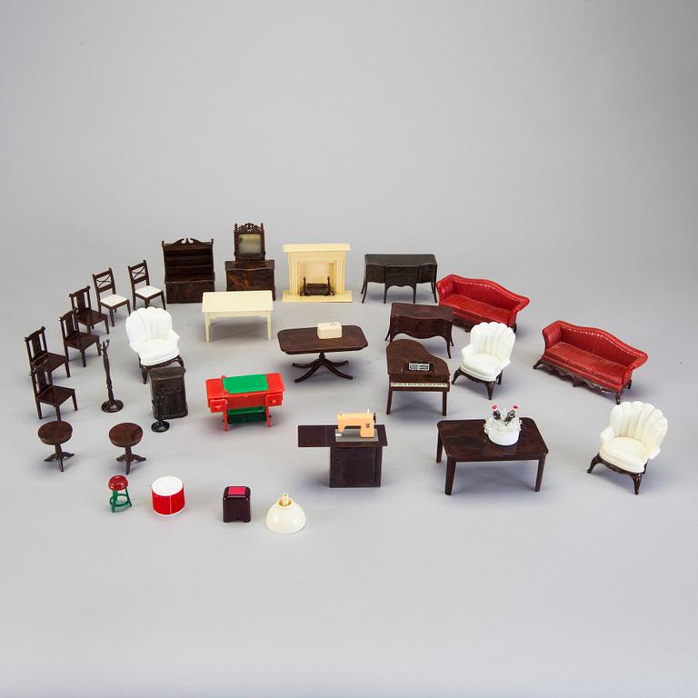 A lot of 26 pieces of plastic doll house furniture mostly by A Renwal products USA first half of the 20th century.