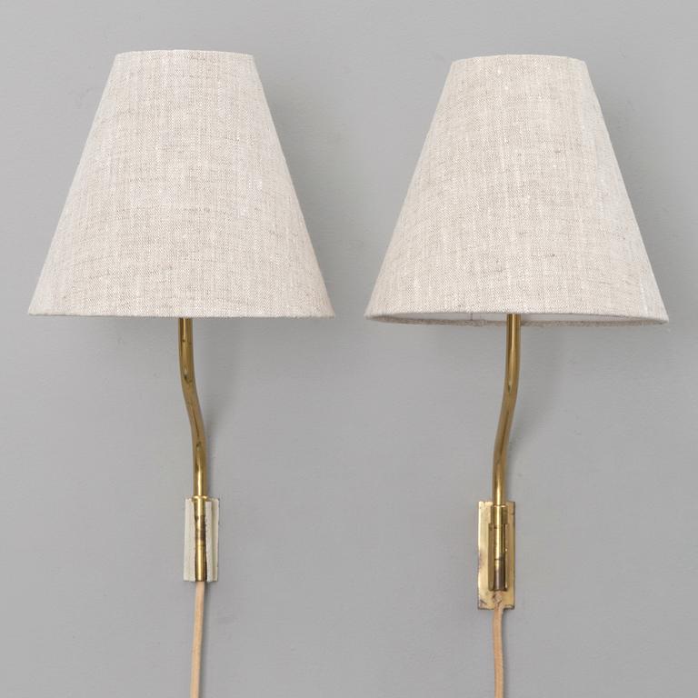 A pair of mid-20th century '3053' wall lights for Stockmann Orno, Finland.