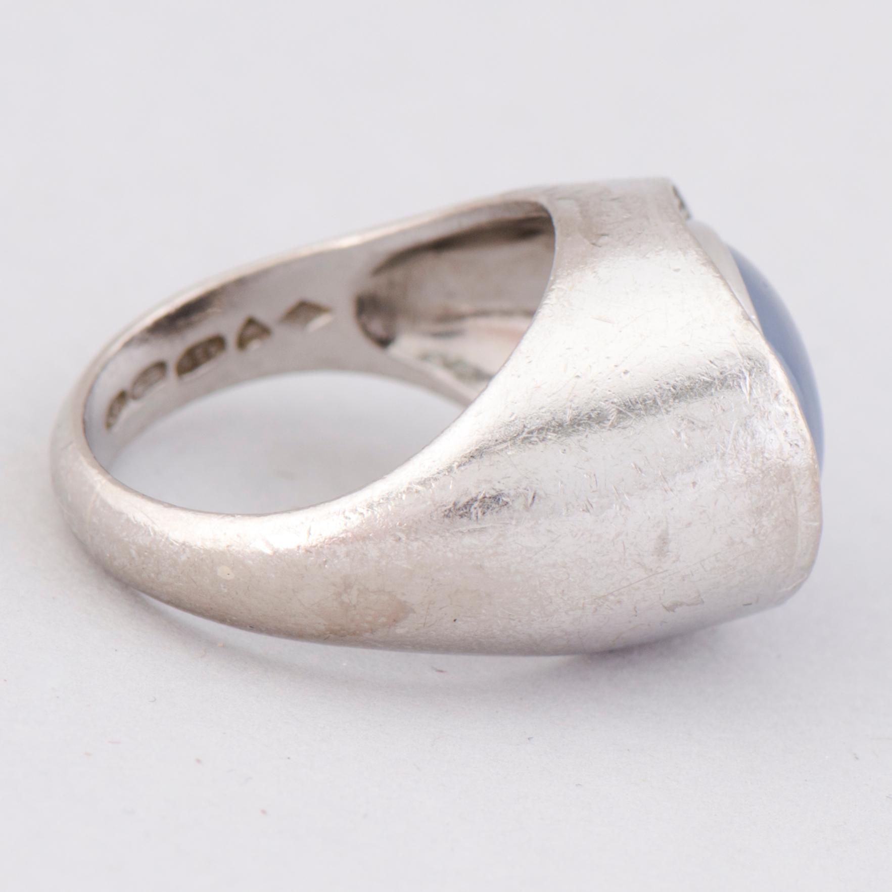 A RING, cabochon cut star sapphire, 8/8 cut diamonds, 18K white gold. A. Tillander, Helsinki Finland 1974.