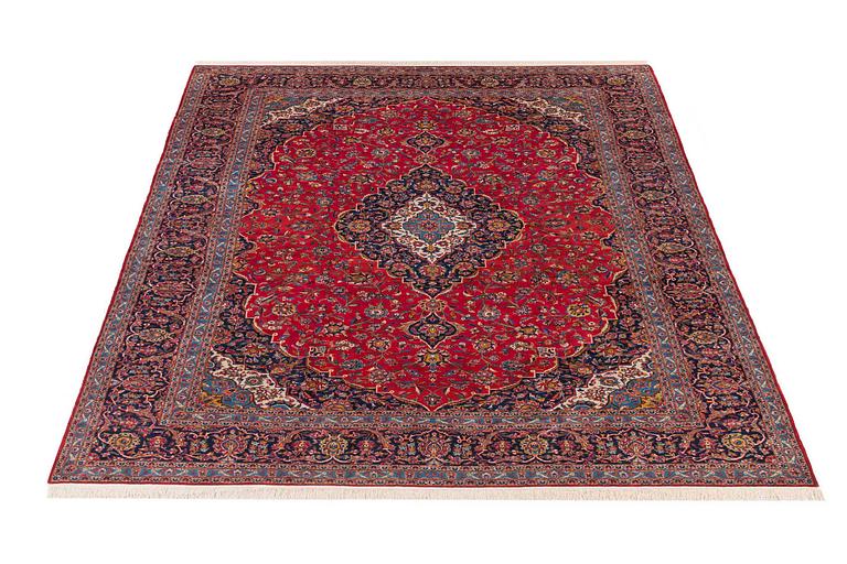 An old Keshan carpet ca 410 x 295 cm.