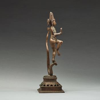 A bronze scupture of Krishna who has konkured the five headed serpant, India, early 20th Century.