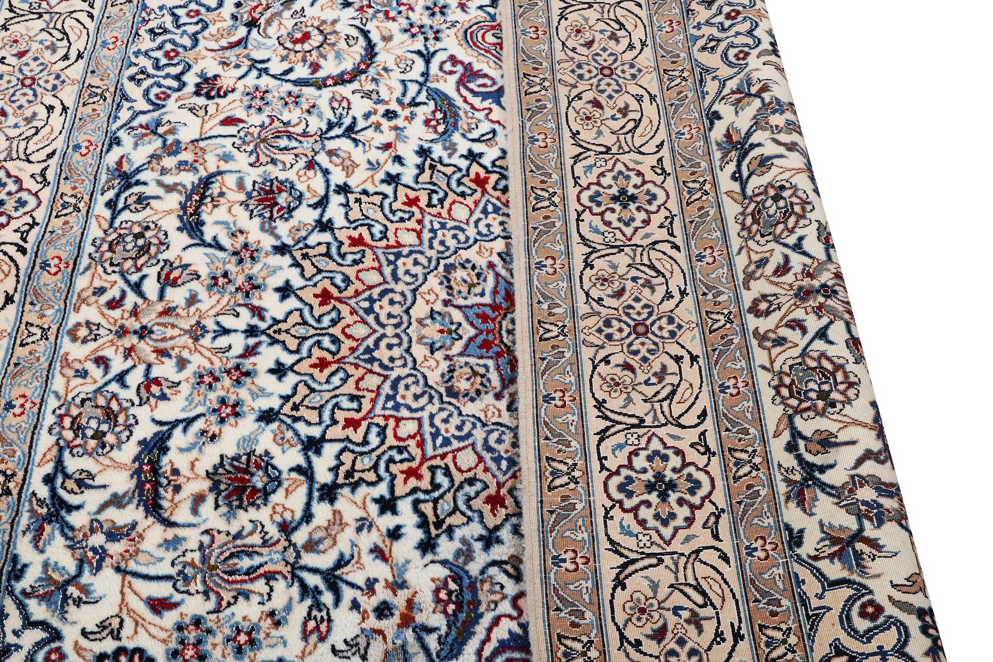 A Nain carpet, part silk, c. 293 x 199 cm.