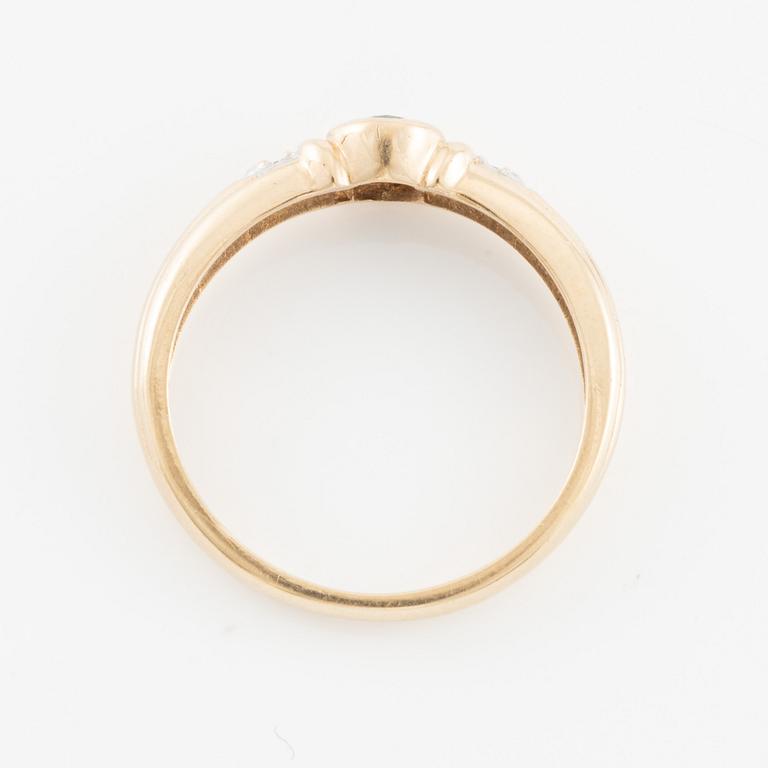Ring, 14K gold with an oval-cut sapphire and brilliant-cut diamonds.