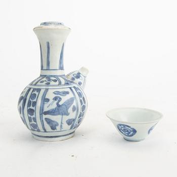 A blue and white kendi and cup, Ming Dynasty.