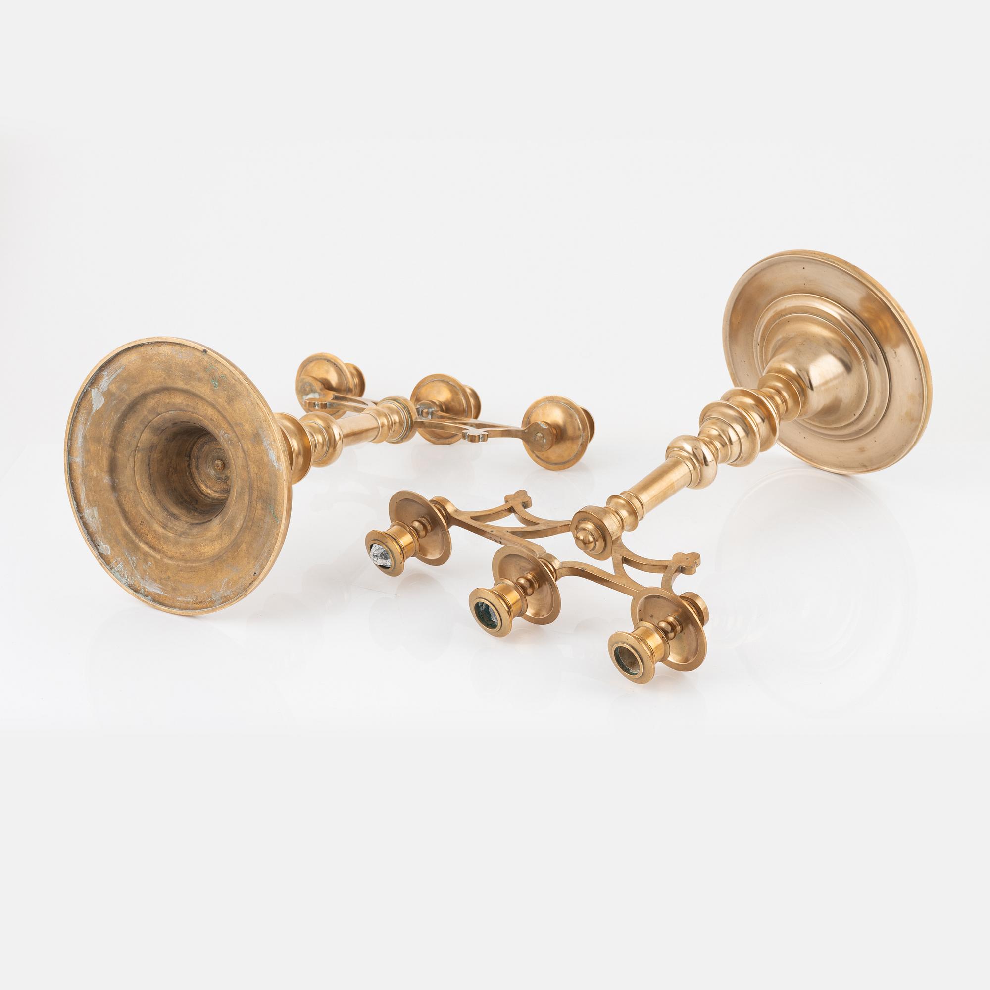 A pair of brass candelabra, early 20th Century.