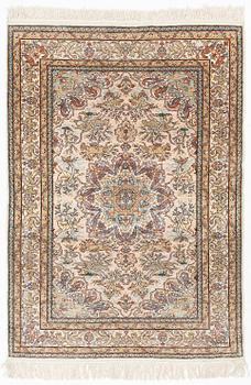 A Turkish silk rug, circa 133 x 101 cm.