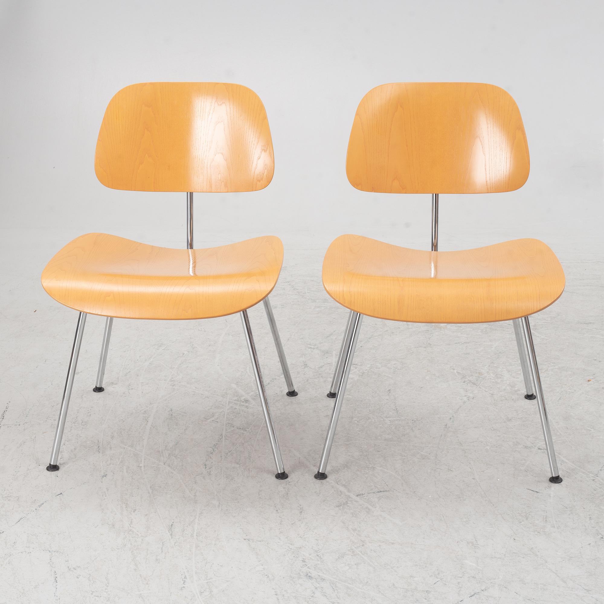 Charles & Ray Eames, a set of four 'DCM' chairs, Vitra, dated 2002.