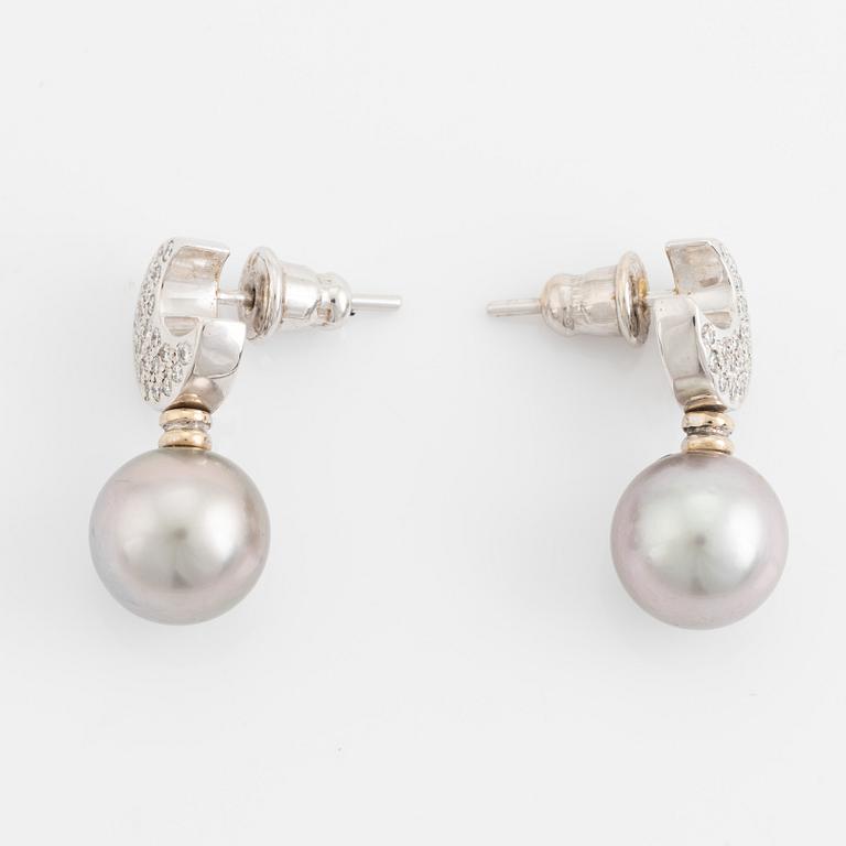 Brilliant cut diamond moon shape and cultured grey pearl earrings.