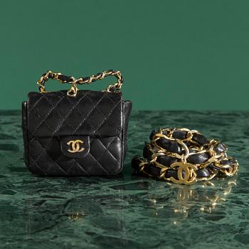 Belt with mini flap-bag by Chanel.