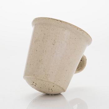 Kyllikki Salmenhaara, a stoneware tea strainer signed KS.
