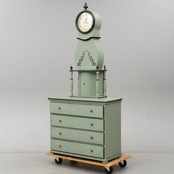 A combined clock and chest of drawers from late 19th  century.