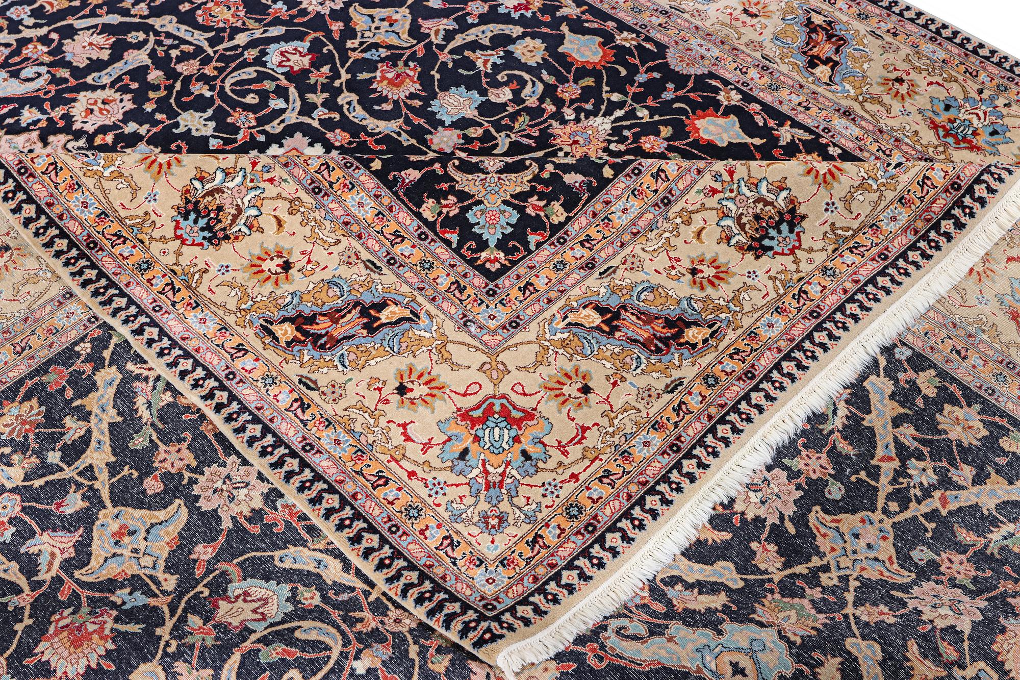 A semi.antique Tabriz carpet, 50 raj, c. 390 x 290 cm.