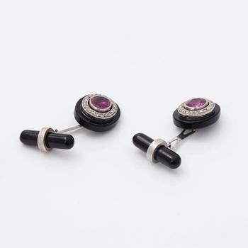 A pair of cufflinks with Burmese rubies, onyx and rose-cut diamonds. Certificate by GCS.