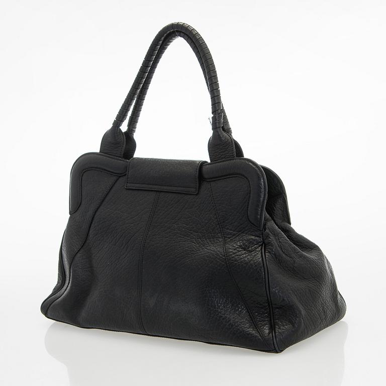 Max Mara, a leather handbag.