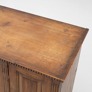 A Gustavian pine cupboard, late 18th century.