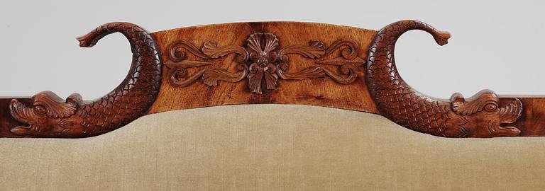 A mahogny veneer Empire sofa. 19th Century.