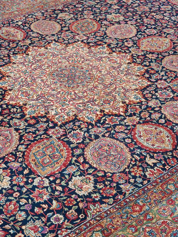 A CARPET. A semi-antique Kerman. 614,5 x 360,5 cm.