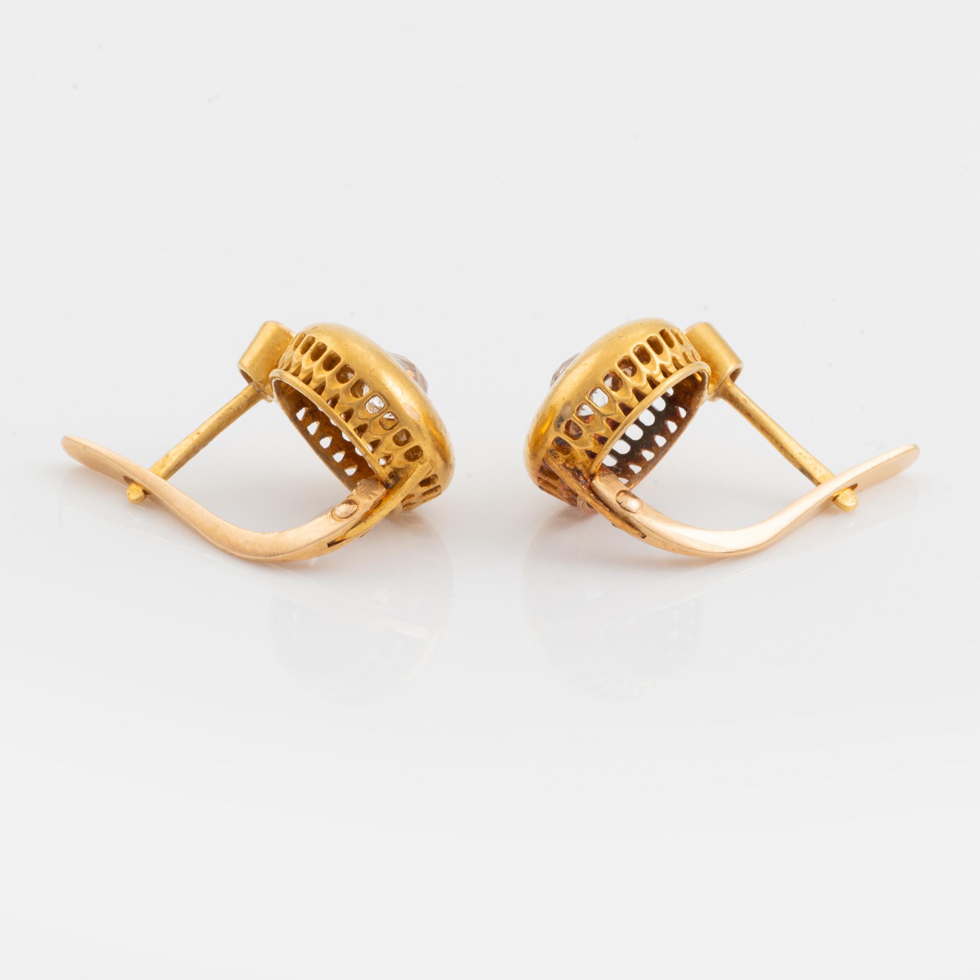 A pair of 18K gold earrings set with old-cut diamonds.