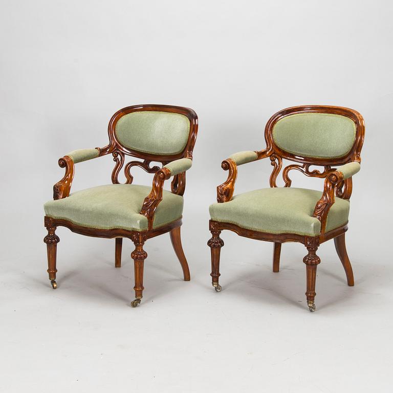 A pair of Russian armchairs and a table, late 19th century.