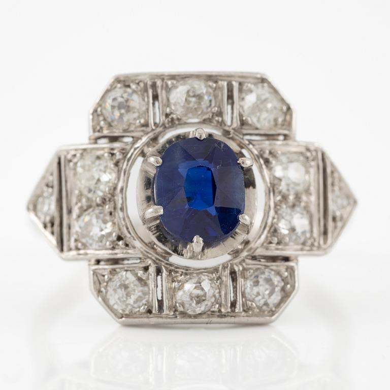 Platinum ring with sapphire and old-cut diamonds.