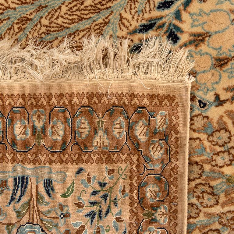 A semiantique part silk nain carpet ca 265 x 163 cm.