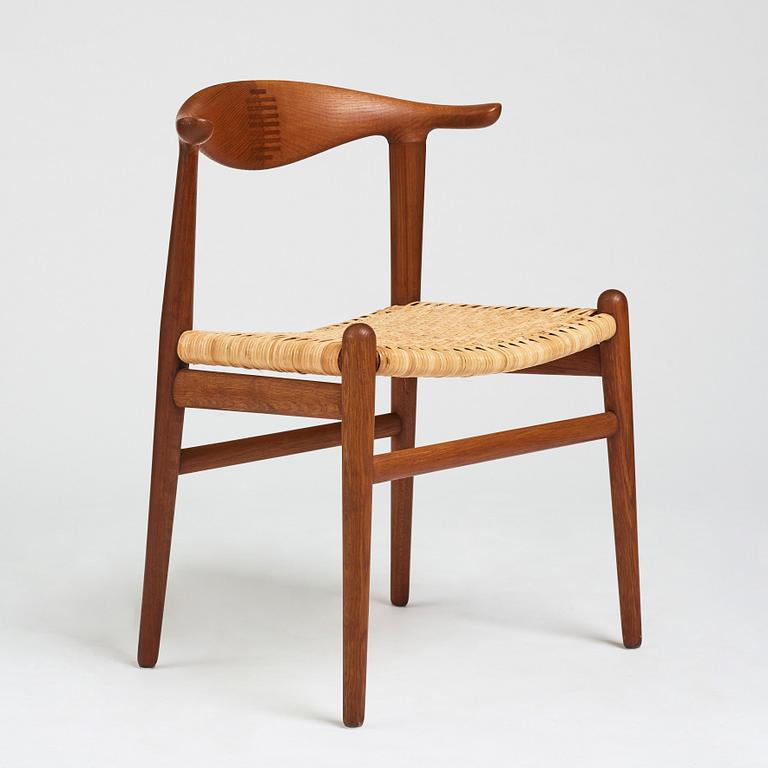 Hans J. Wegner, a teak, oak and cane "Cowhorn chair", JH 505, Johannes Hansen, Denmark 1950-60's.