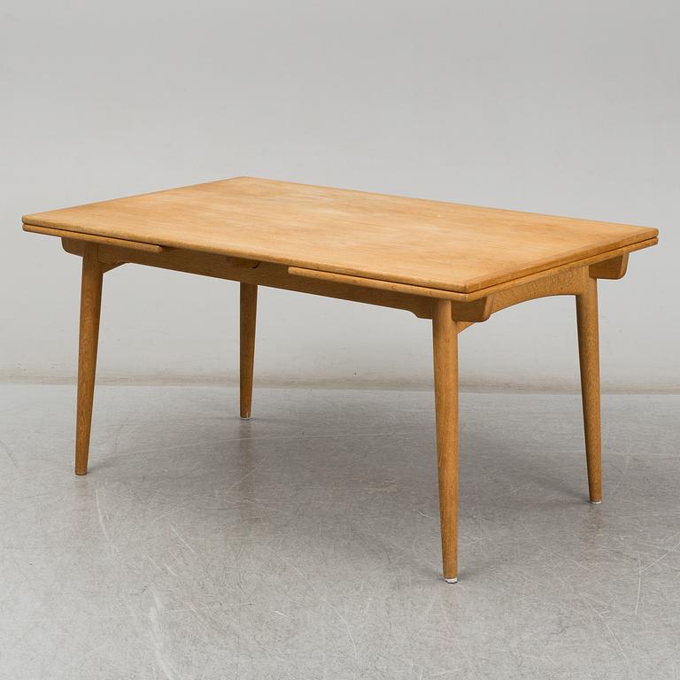 HANS J WEGNER, an "AT-312"  oak dining table. Andreas Tuck, Denmark.