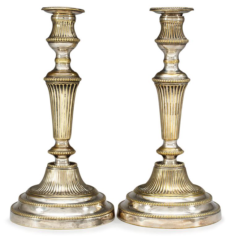 A pair of 19th century silvered candlesticks.