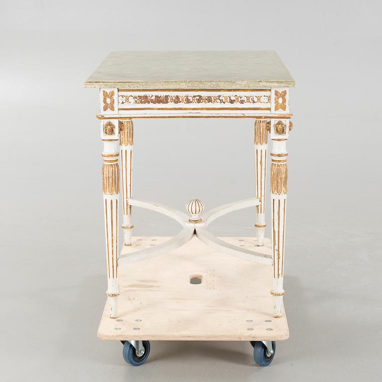 A late gustavian style table, around the year 1900.