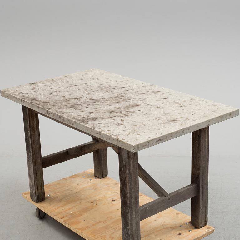 A Limestone and wood table.