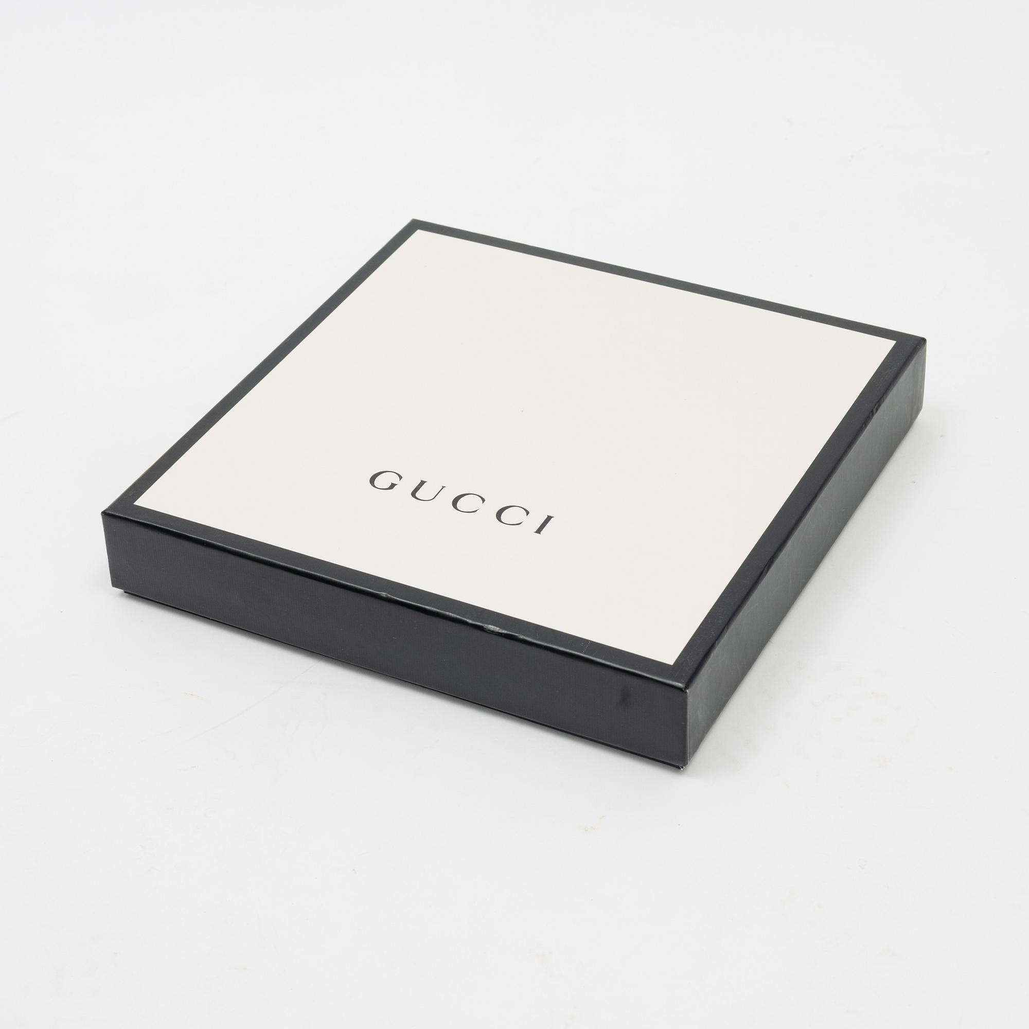 Gucci, a 'Flora' silk scarf.