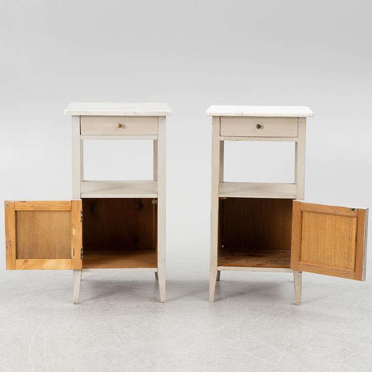 A matched pair of bedside tables.