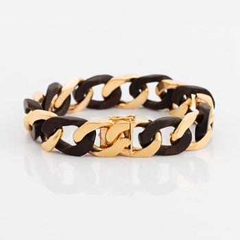 A Van Cleef & Arpels 18K gold and wood bracelet.