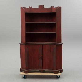 A 19th century corner cupboard.