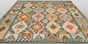 A Kelim carpet, 306 x 257 cm.