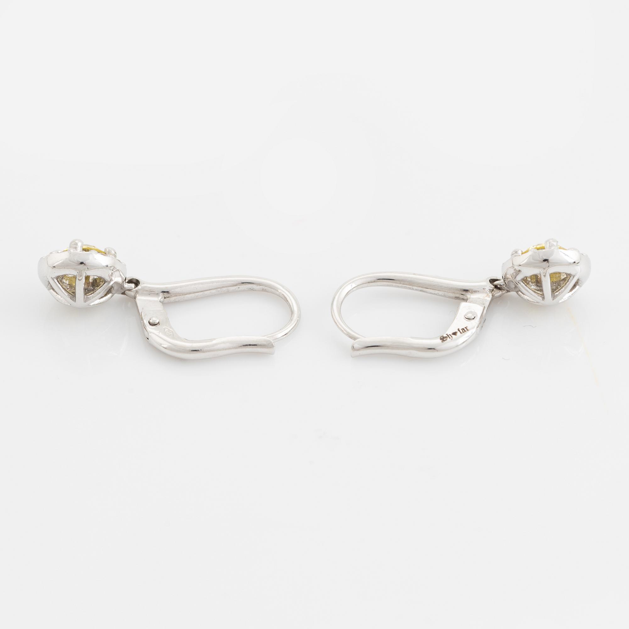 Colour treated brilliant cut diamond earrings.