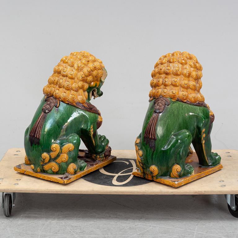 A pair of sancai-glazed chinese buddhist lions or guardian lions, early 20th century.