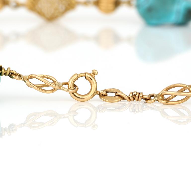 HALSBAND, 18K guld med ofasetterade turkoser.  Total vikt ca 36 g.